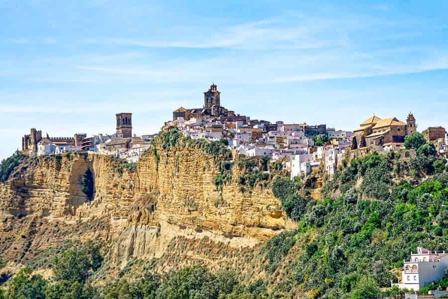 Beautiful distant view of Arcos de la Frontera – a must see as you road trip Andalucia.