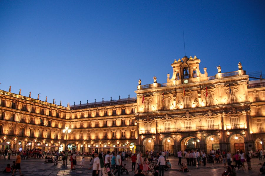 Salamanca’s Plaza Mayor illuminated beautifully at night – one of the highlights of our road trip in Spain.