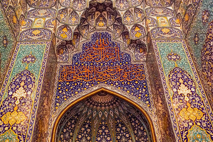 The intricate Mihrab at Sultan Qaboos Grand Mosque in Muscat is one of the amazing places to include on your Oman itinerary.