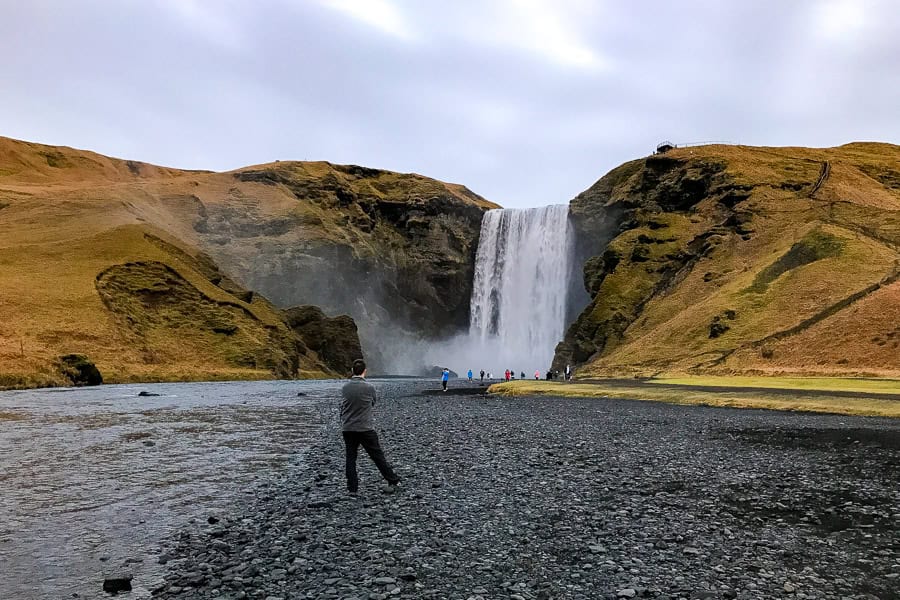 View of Skógafoss from beside the Skógá River – a must visit site on our 7 day itinerary for Iceland. 