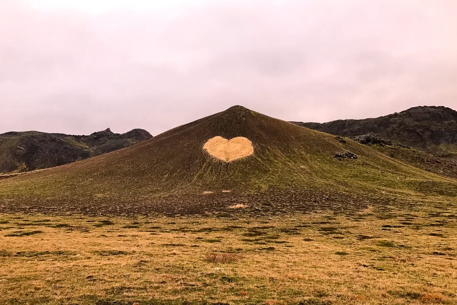 A heart shape carved into a hill, the perfect symbol for our self-drive Iceland road trip itinerary.