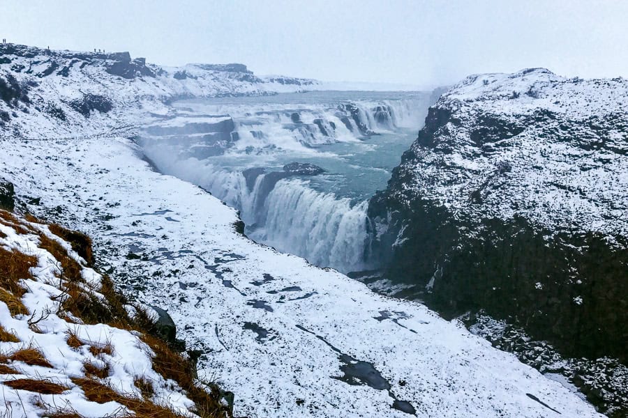 A waterfall falls in stages at Gulfoss, one of the highlights of driving the Golden Circle route.