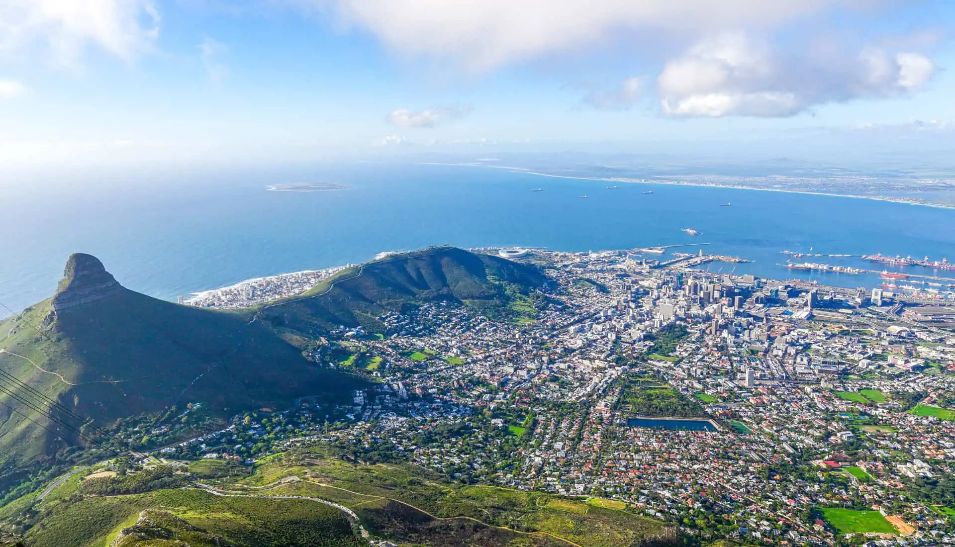 View across Cape Town from Table Mountain with Lions Head in the foreground – a highlight of our Cape Town itinerary.