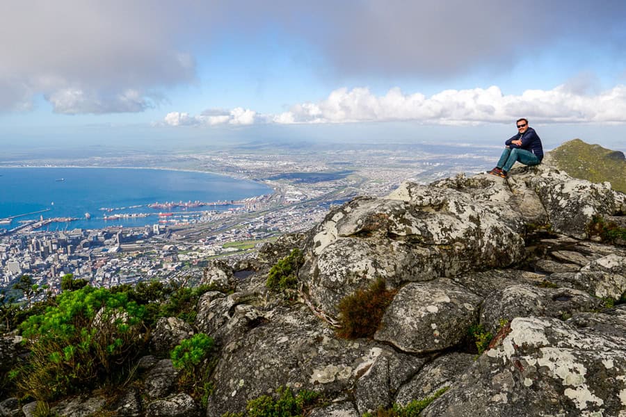 A person admires the incredible view over cape town from Table Mountain – a must for any itinerary for Cape Town.