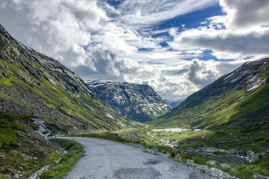 Roads in Norway can be truly spectacular, like this one that winds through snow covered mountains towards a glacier lake.